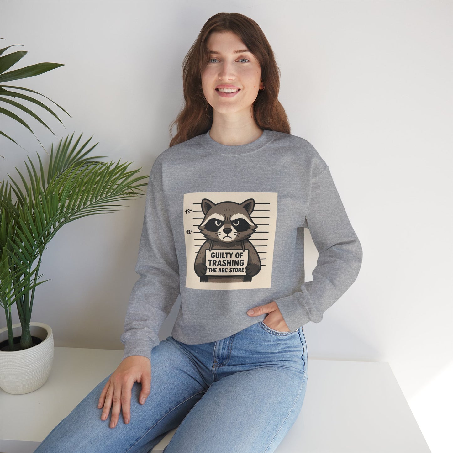 “Guilty of Trashing the ABC Store” Raccoon Unisex Heavy Blend™ Crewneck Sweatshirt