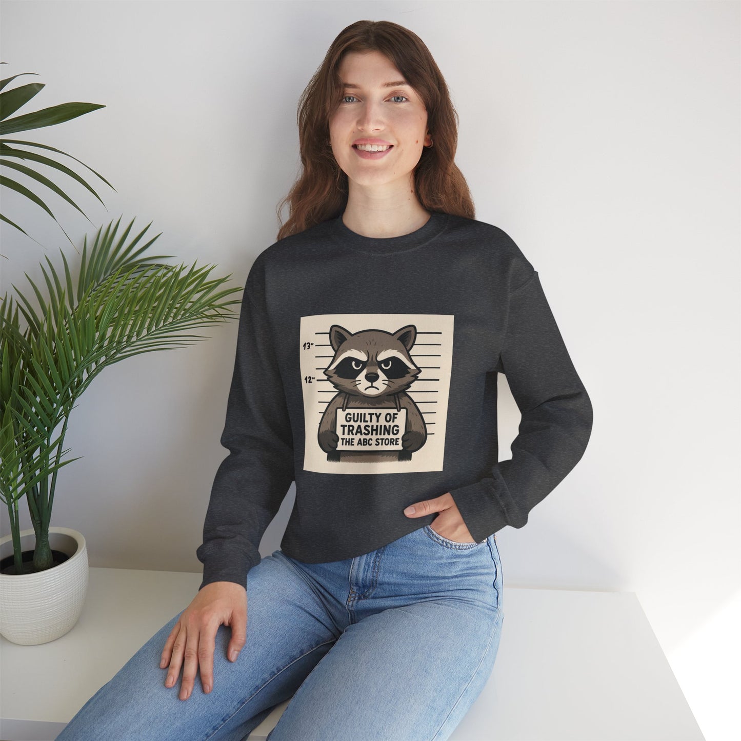 “Guilty of Trashing the ABC Store” Raccoon Unisex Heavy Blend™ Crewneck Sweatshirt
